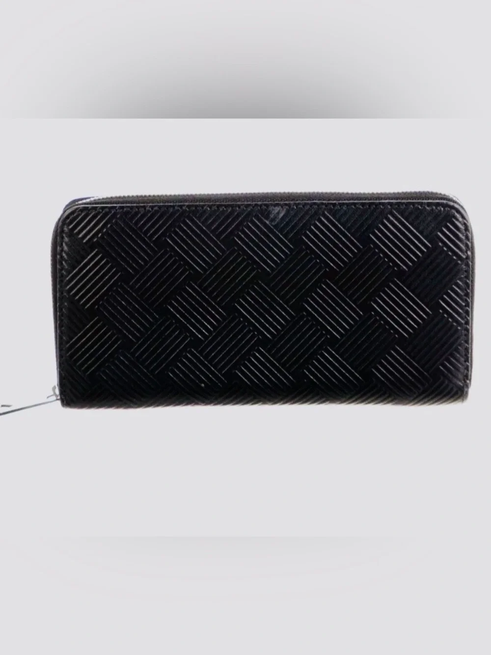 BOTTEGA VENETA Black Zip Around Wallet in Intrecciato Debossed Calfskin. UNISEX.